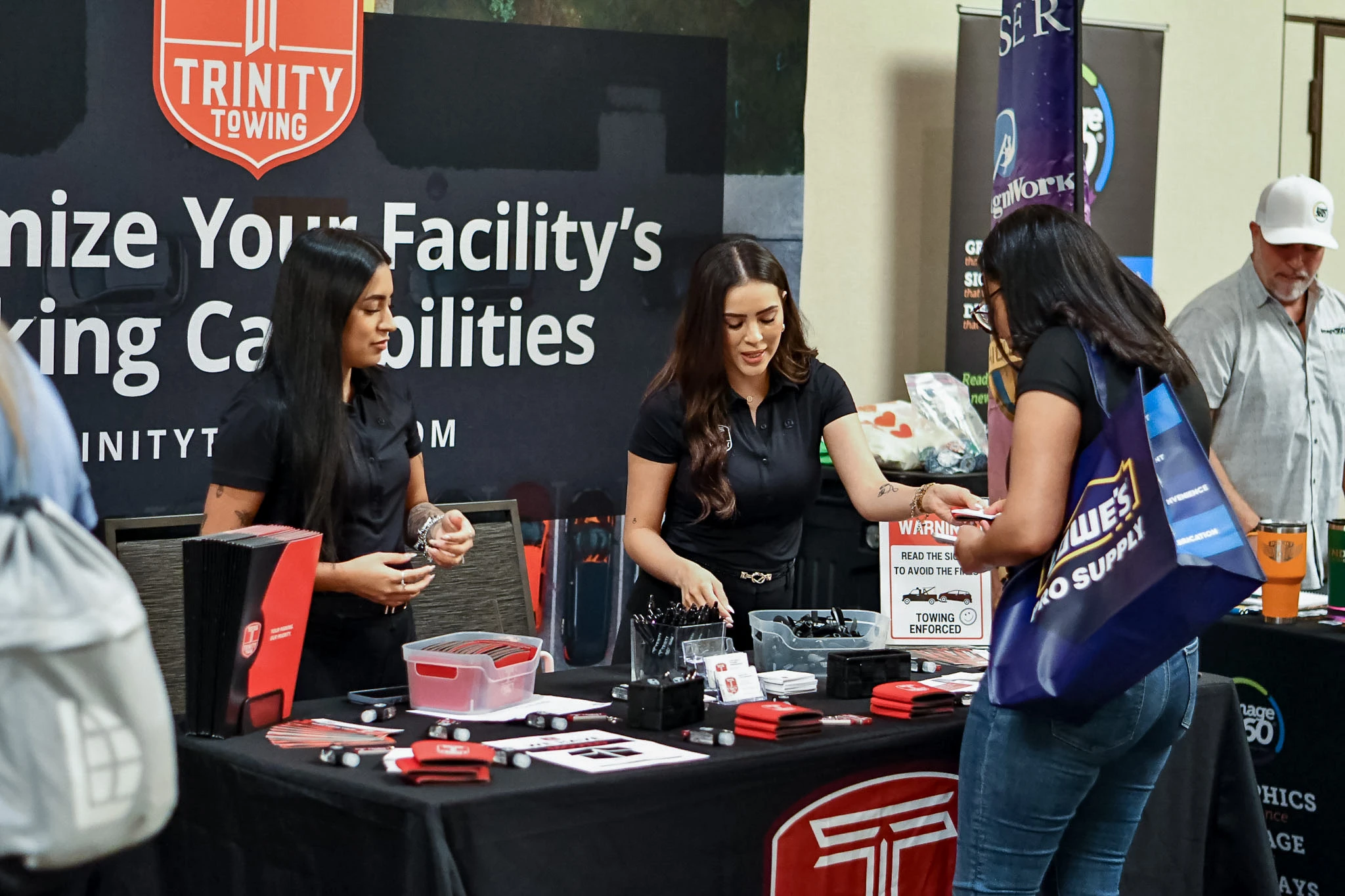 Conference attendees connecting with exhibitors at a partner booth