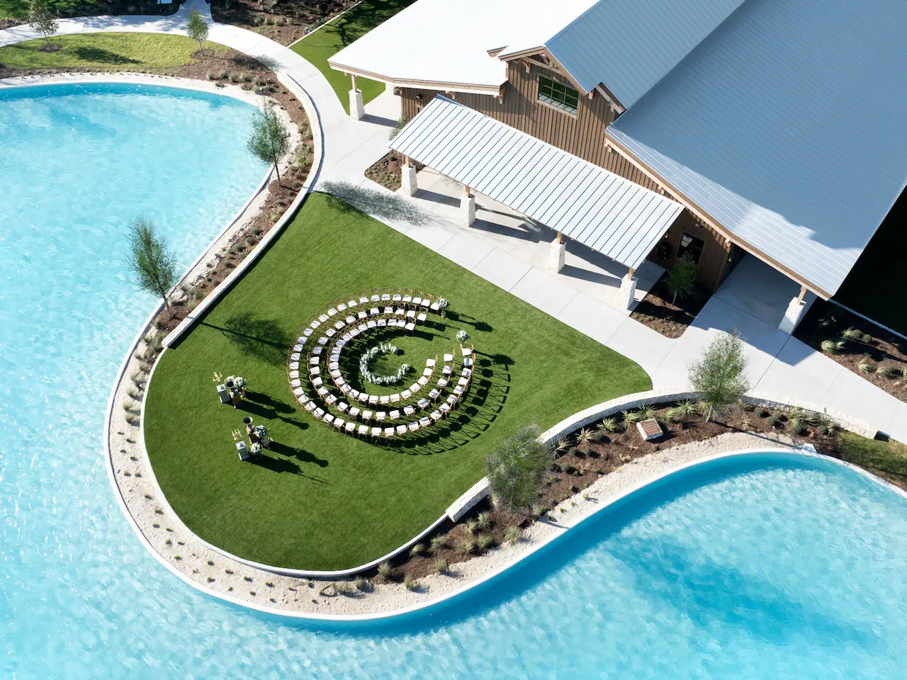 Rancher Hall exterior and outdoor gathering space at Hyatt Regency Hill Country